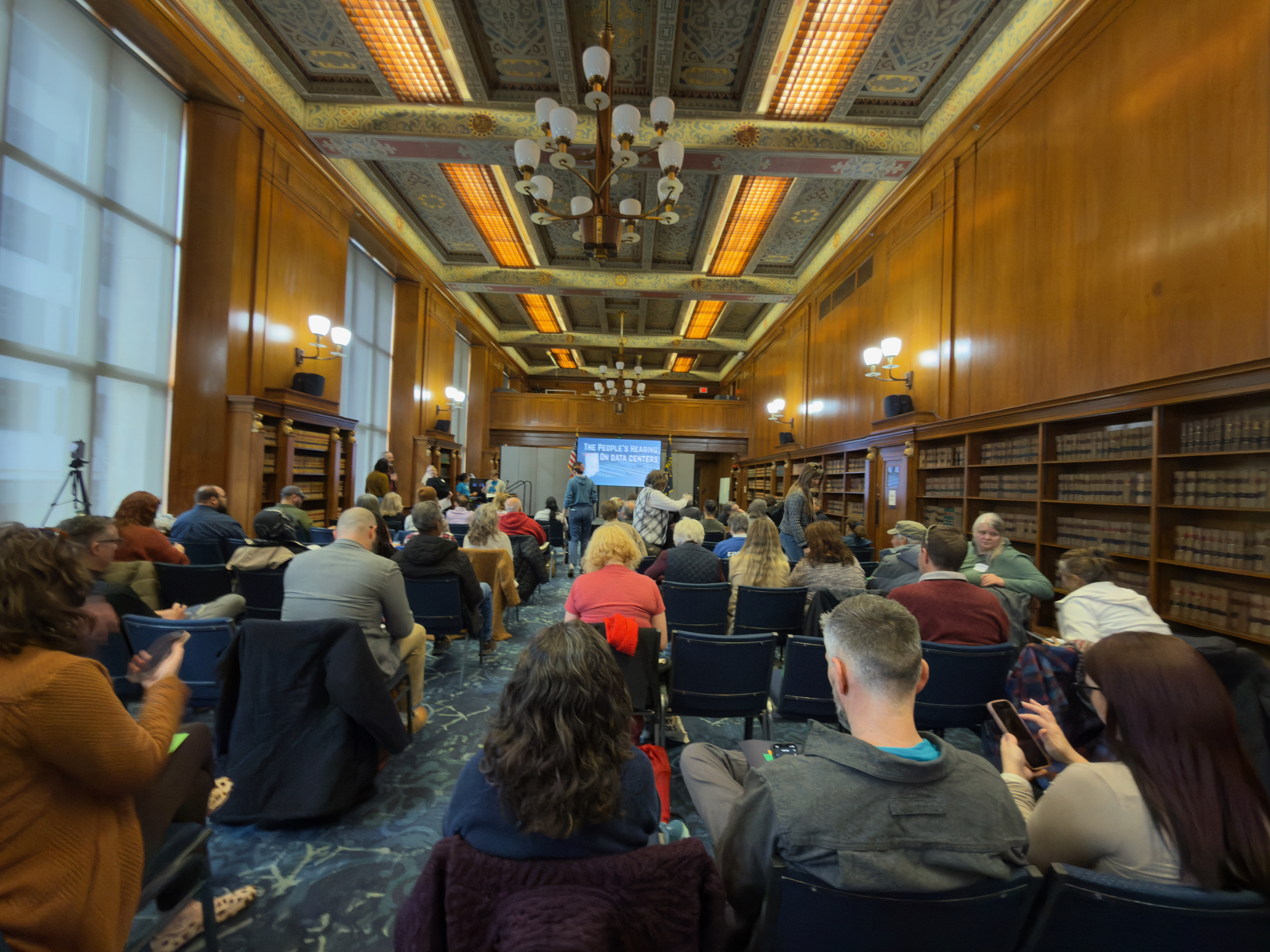 A crowd of people sits waiting for a public hearing about datacenters in Indiana to begin.